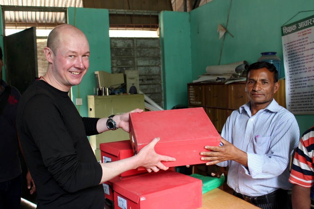 And here I am giving some donated training materials to Shree Buddha School Principal Ragunath Baniya (Photo: CHANCE)