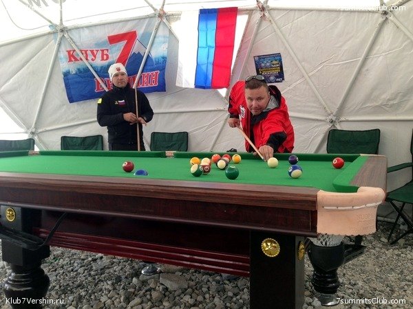 Members of the Russian 7 Summits Club expedition play pool in their dome tent at Everest Base Camp, Tibet (Photo: 7 Summits Club)