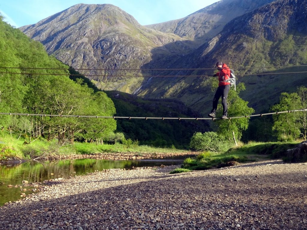Crossing the infamous wire bridge over the Water of Nevis
