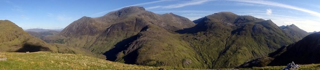 Panorama of Glen Nevis, Ben Nevis, Carn Mor Dearg and Aoneag Beag from a balcony on the way up An Gearanach