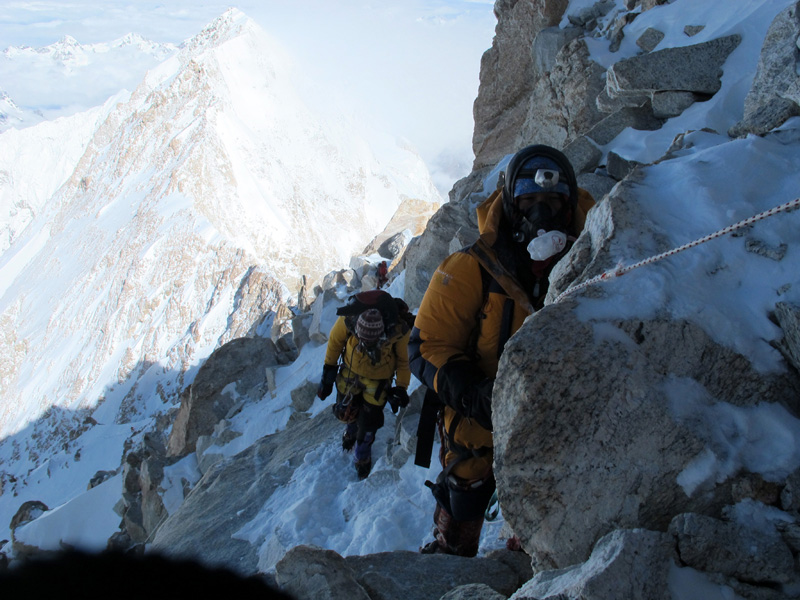 Climbing just below the summit of Kangchenjunga, close to the place Joe Brown called the world's best picnic site. The peak behind is Yalung Kang (Photo: Anselm Murphy).