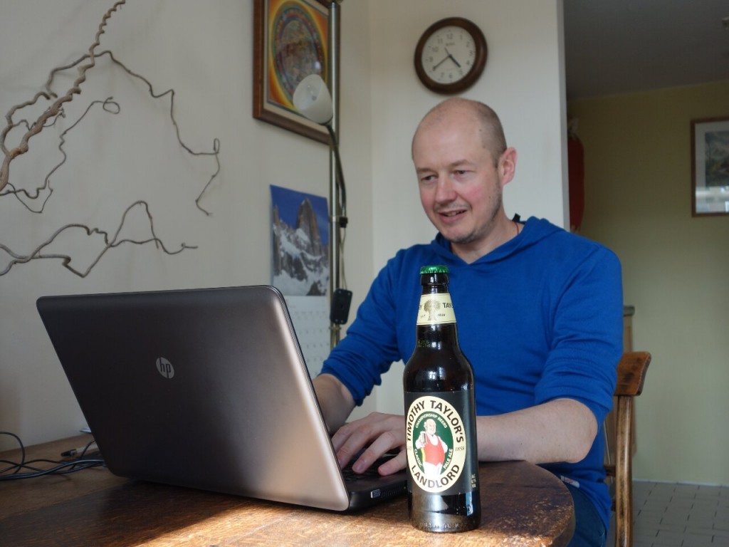 Here I am tapping away at the first draft. I'm not allowed the beer until I've written at least 2,000 words.