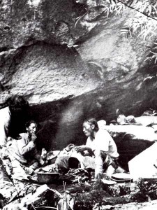 Kusang, Angtharkay and Pasang prepare a meal of mushrooms and bamboo shoots at their boulder camp in a bamboo forest, during their expedition to Garhwal and Nanda Devi in 1934 (Photo: Eric Shipton)