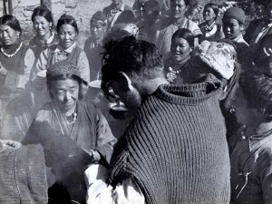 Sepp Jochler is forced to drink chang (local millet beer) by Sherpa women after the first ascent of Cho Oyu (Photo: Herbert Tichy)