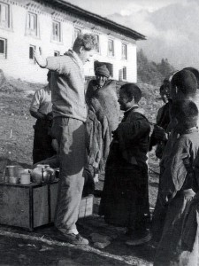 Griffith Pugh was a figure of fun for many on the 1953 expedition. Here some local Nepalese boys laugh at the size of his equipment (Photo: Royal Geographical Society).